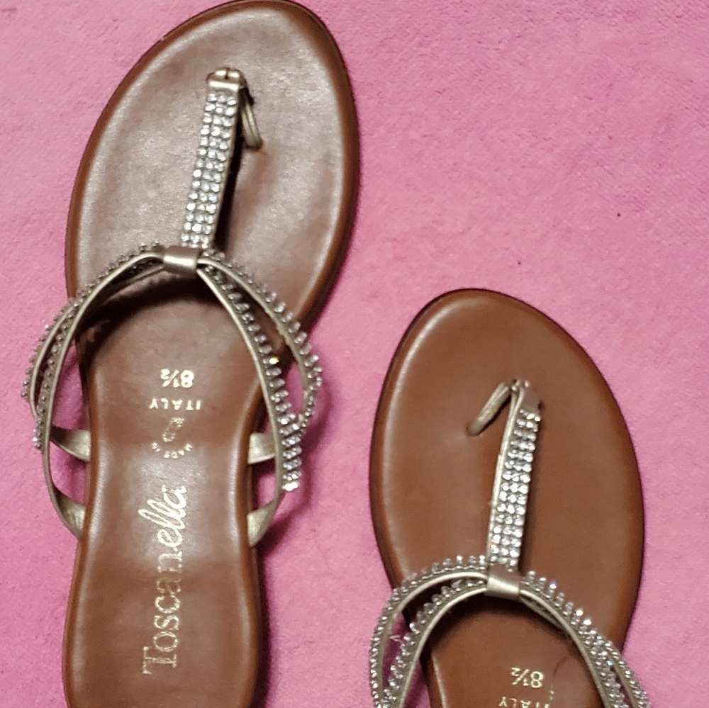 Flat thong sandles with rhinestone straps.